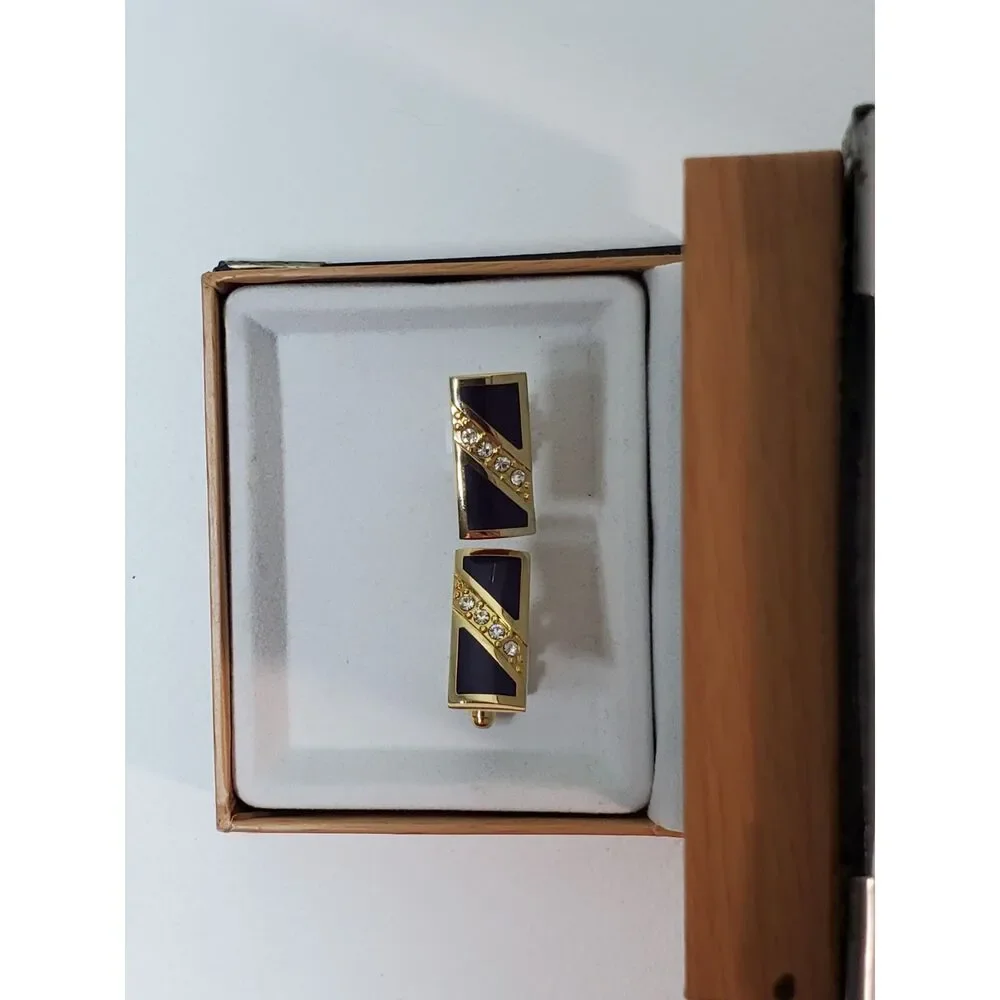 The Cufflinks are gold-toned with purple inlay Great Gift